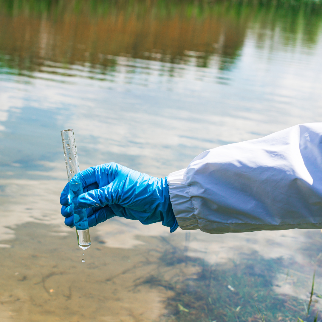 Hand holding a test tube